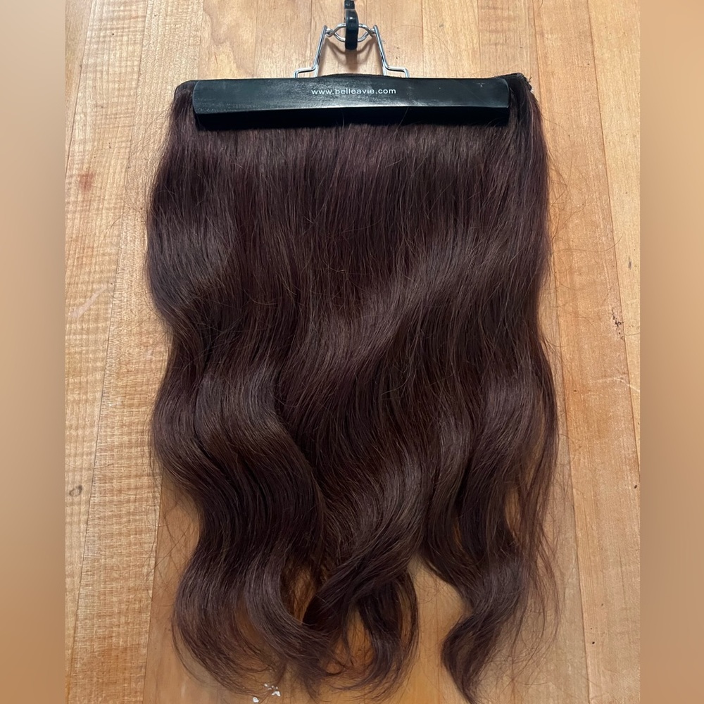 Brunette, hairpiece, never been worn. Human hair, easy to place, curl, and dye.